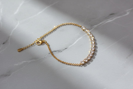 Coco Pearls Stainless steel anti tarnish Gold 13 stars bracelet with 13 diamonds on a light gray background,