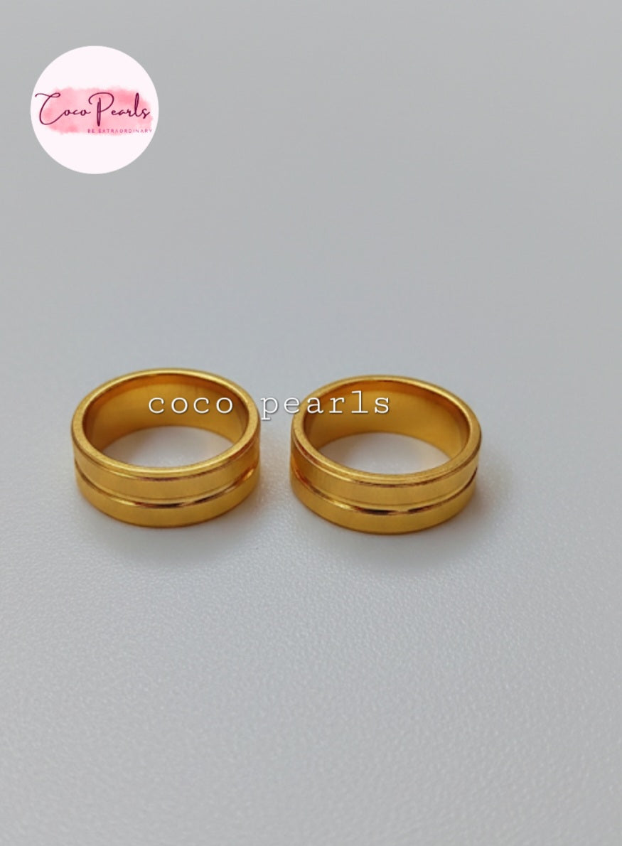 Coco Pearls Stainless Steel Anti Tarnish eternal ring. Two gold rings bands on white background