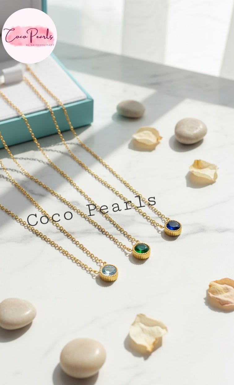 Coco Pearls Stainless Steel Anti Tarnish gem stone glam necklace three milestone necklaces green black and clear necklaces on a simple background