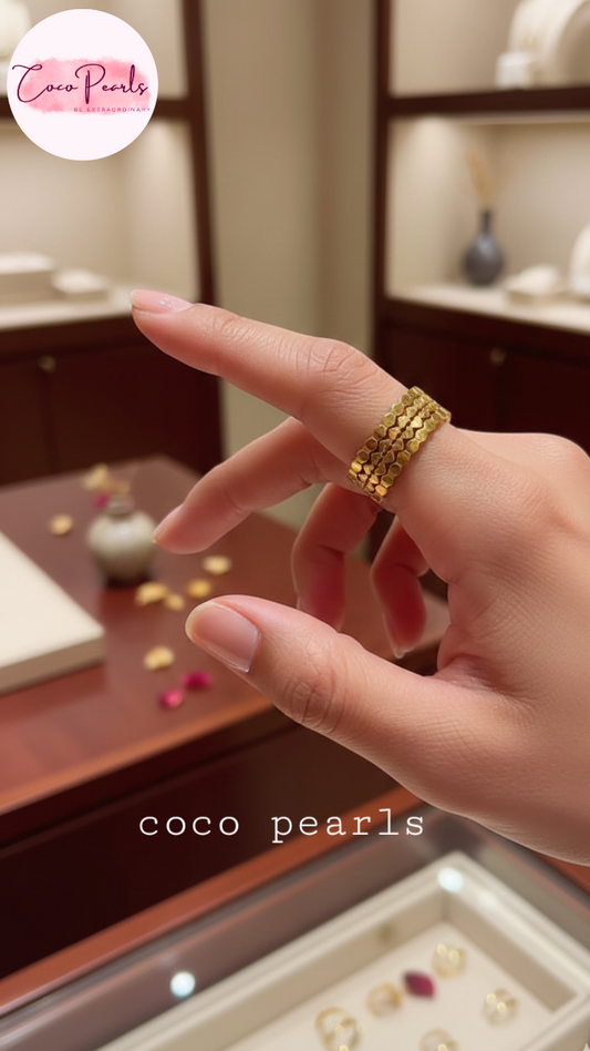 coco pearls stainless steel anti tarnish gold hive adjustable ring displayed on a finger