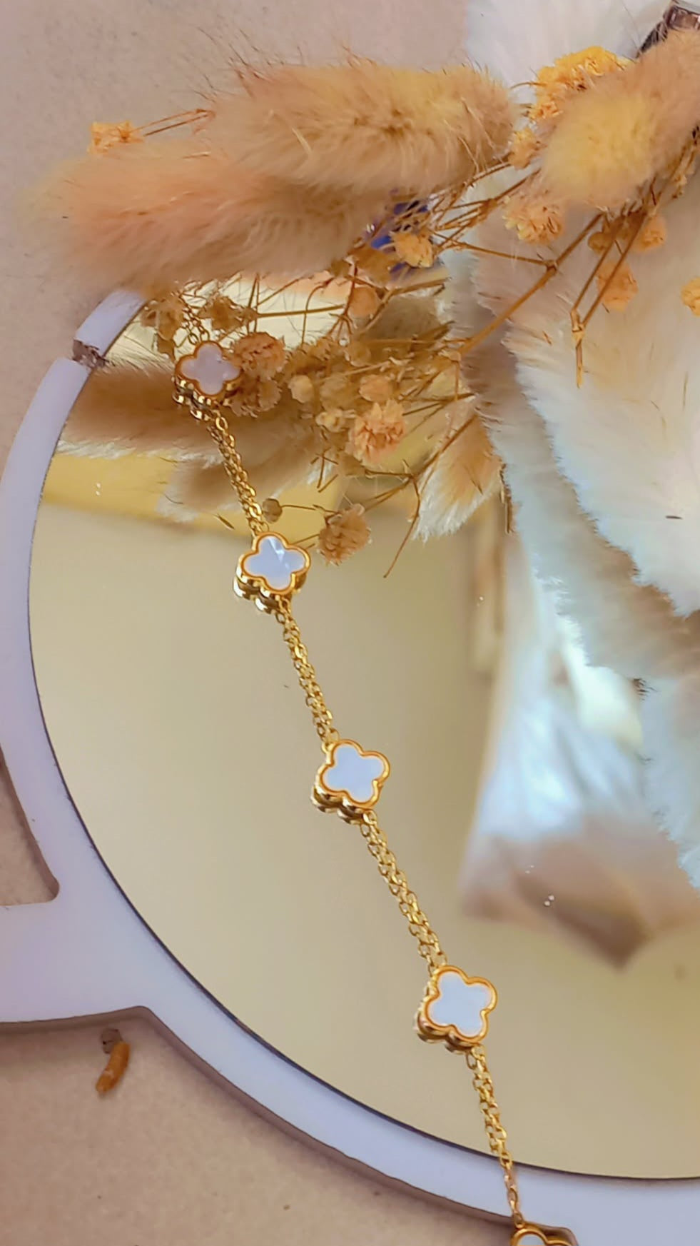 Coco Peals Stainless Steel anti tarnish Gold ;ittle clover bracelet with clover-shaped charms on a white surface