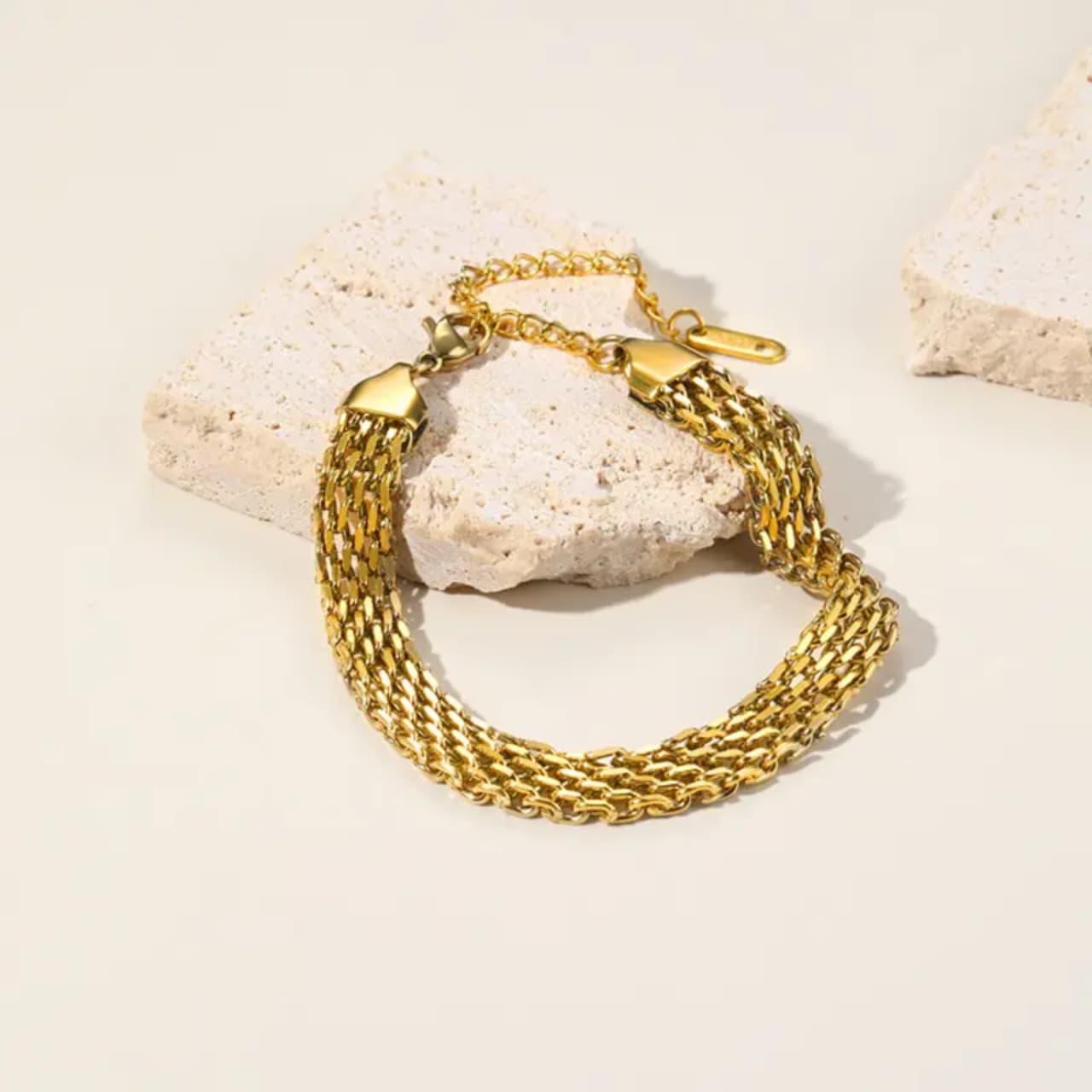 Coco Pearls Stainless steel anti tarnish mesh majesty Gold chain bracelet on a textured beige surface
