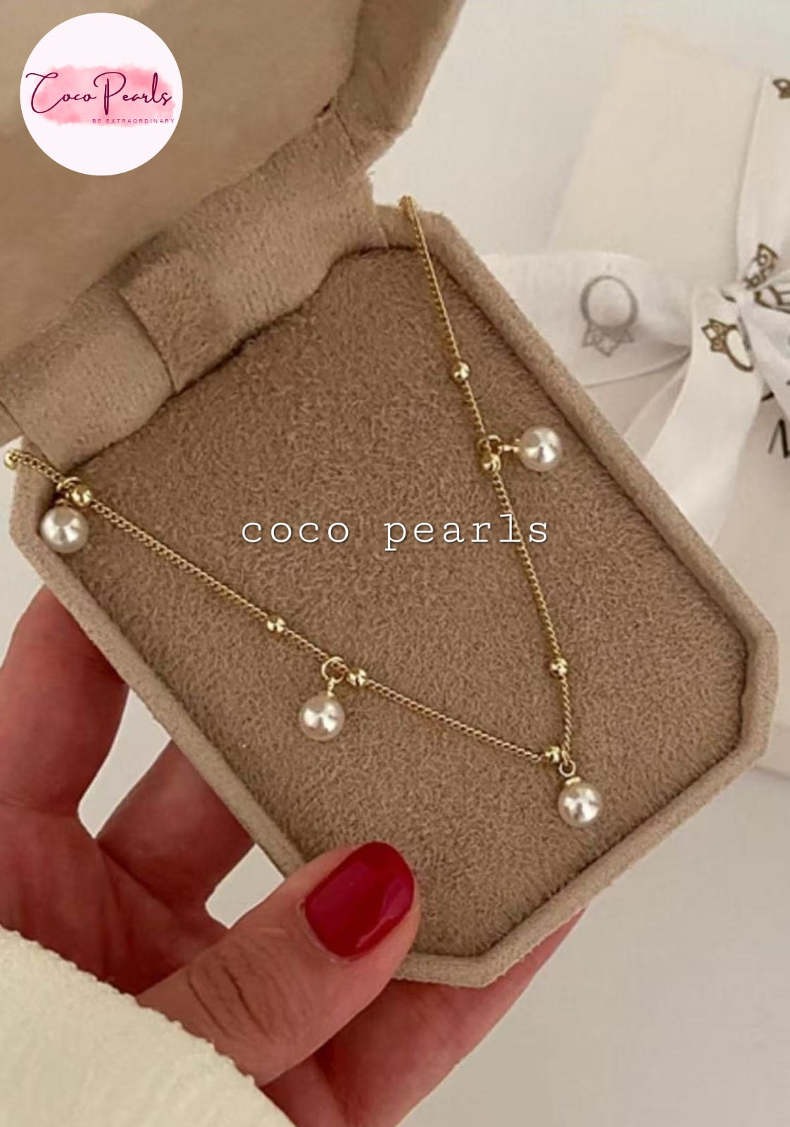 Coco Pearls Stainless Steel Anti Tarnish Gold pearl chain anklet with pearls on a box held by a hand.