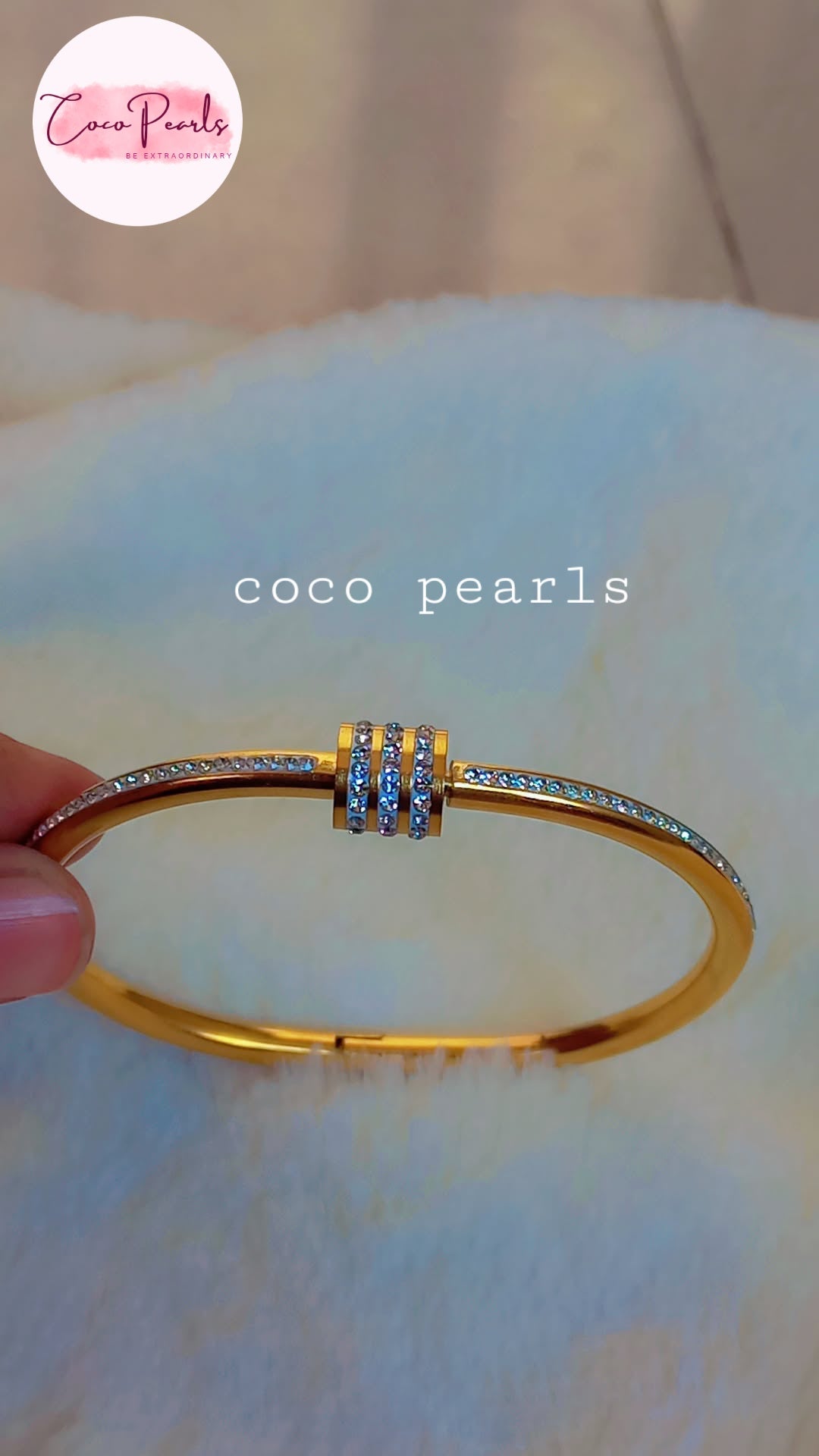 coco pearls stainless steel anti tarnish gold shimmering crown diamond studded handcuff displayed on white fabric