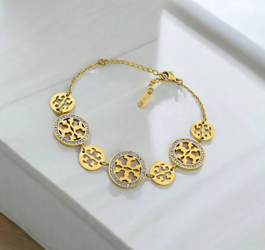 Coco Pearls Stainless steel anti tarnish Gold sparkly vibe bracelet with diamond studded circular designs on a white surface