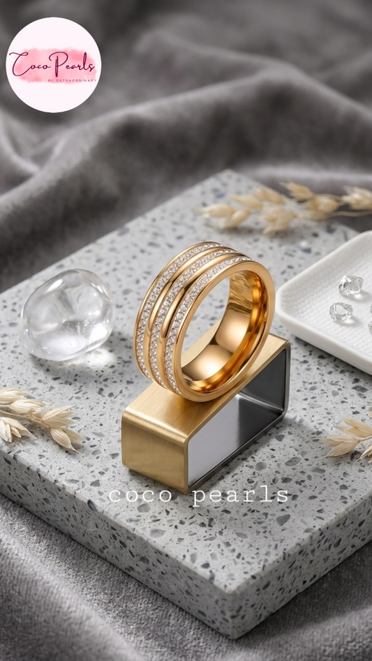 Coco pearls stainless Steel anti tarnish gold triple sparkle ring band with 3 layers of dimaond studded all over band displayed on simple background