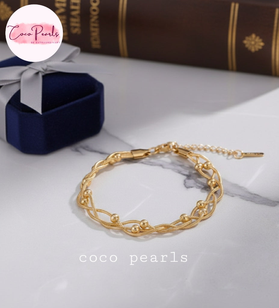 coco pearls stainless steel anti tarnish gold twisted braid bracelet with 3 ball chains twisted in a braid