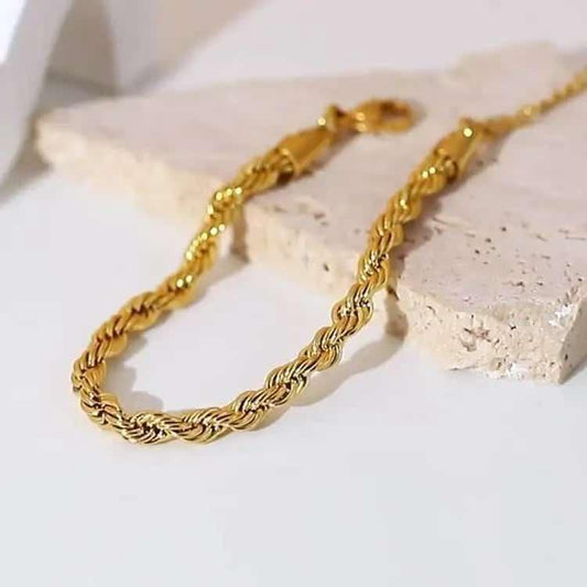 Coco Peals Stainless Steel anti tarnish Gold twisted rope chain necklace on a light stone surface