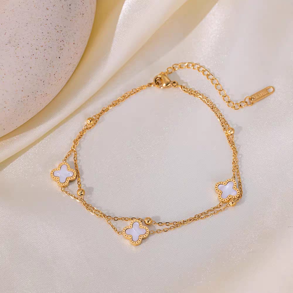 Coco Peals Stainless Steel anti  tarnish Gold 3 clover double chain bracelet with white clover charms on a light background