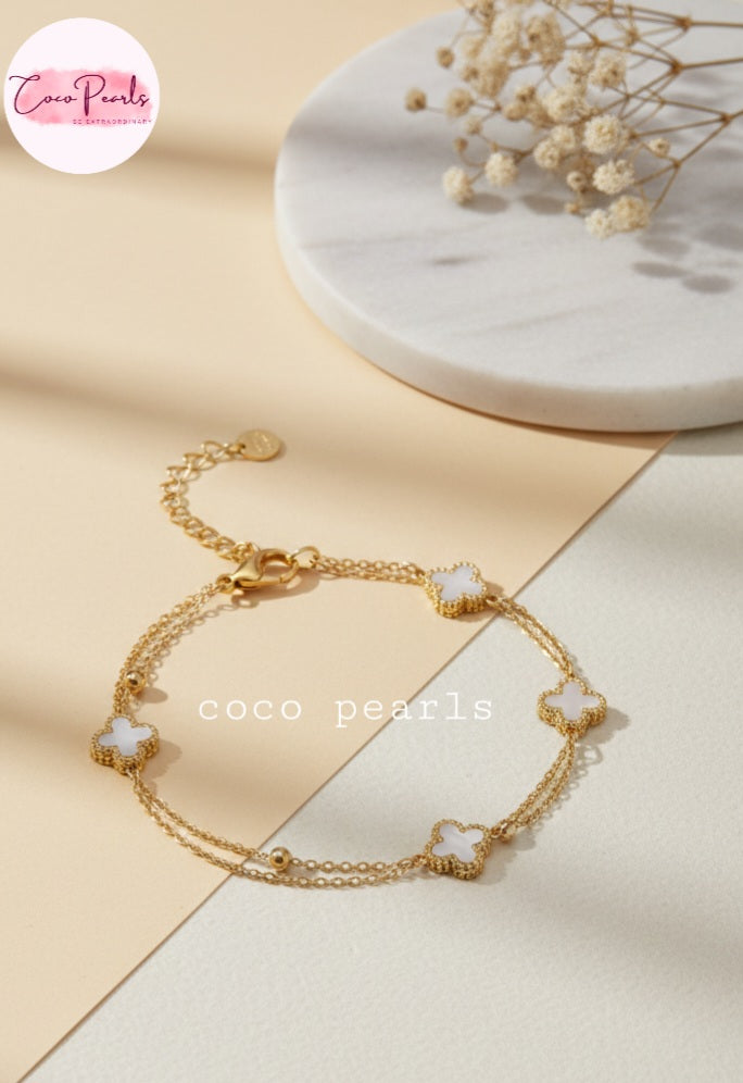 Coco Peals Stainless Steel anti  tarnish Gold 3 clover double chain bracelet with white clover charms on a light background