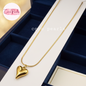 Coco pearls stainless Steel anti tarnish gold heart pendant displayed on simple background 