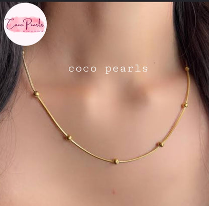 Coco pearls stainless Steel anti tarnish gold ball chain displayed on model neck