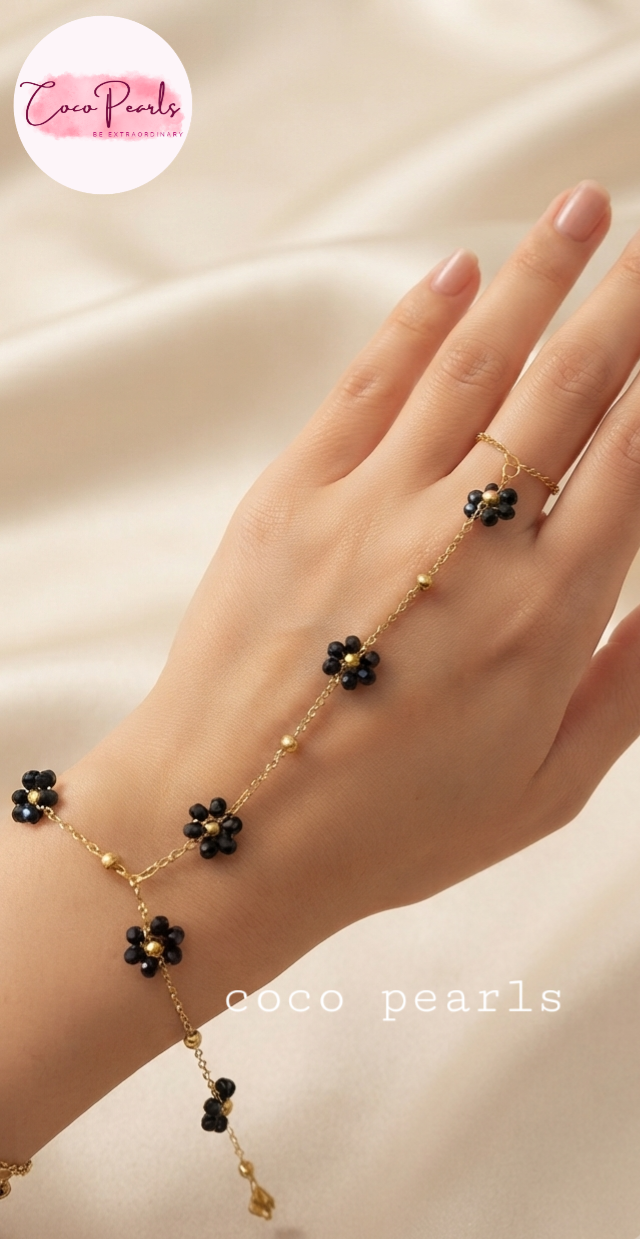Coco pearls stainless Steel anti tarnish black flower with gold chain hand harness displayed on hand 