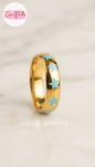 Coco pearls stainless Steel anti tarnish gold blue star rings displayed on simple background 
