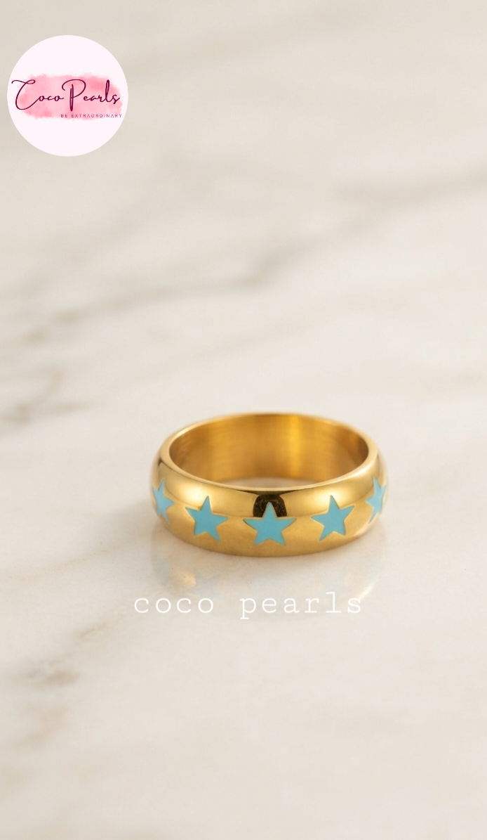Coco pearls stainless Steel anti tarnish gold blue star rings displayed on simple background 