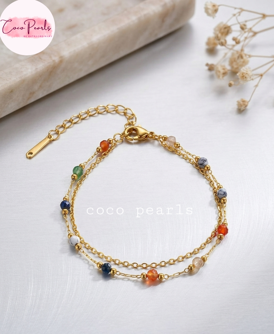 Coco pearls stainless Steel anti tarnish Gold boho gemstone bracelet with colorful beads on a light surface