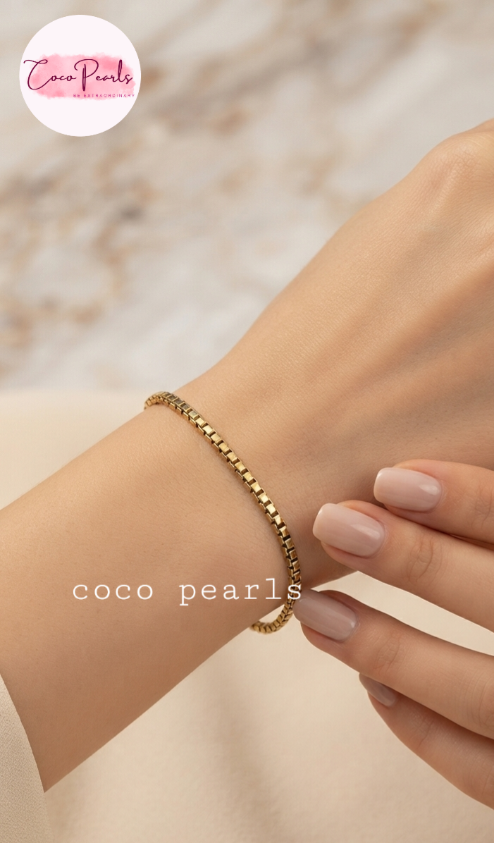 Coco pearls stainless Steel anti tarnish delicate gold box-link chain bracelet worn on a woman's wrist