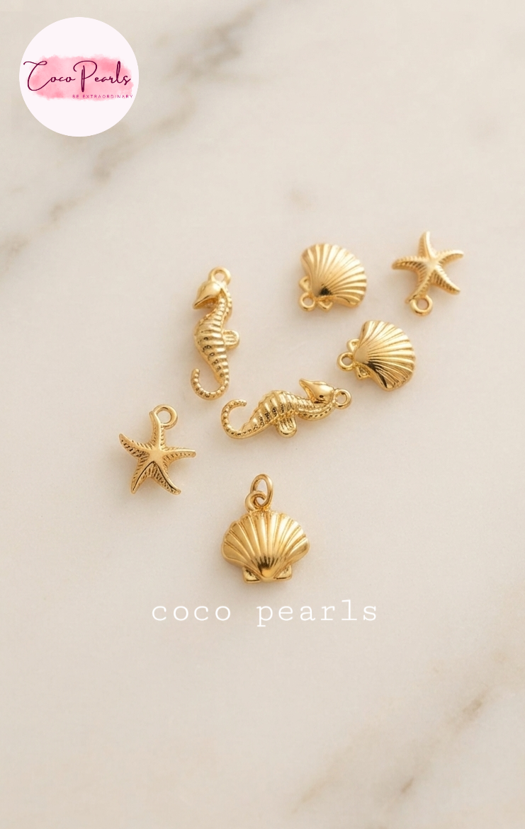 Coco pearls stainless Steel anti tarnish gold charms displayed on simple background 