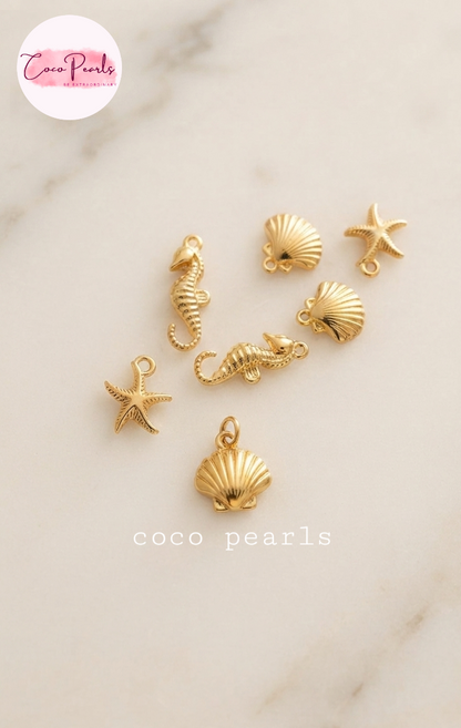 Coco pearls stainless Steel anti tarnish gold charms displayed on simple background 