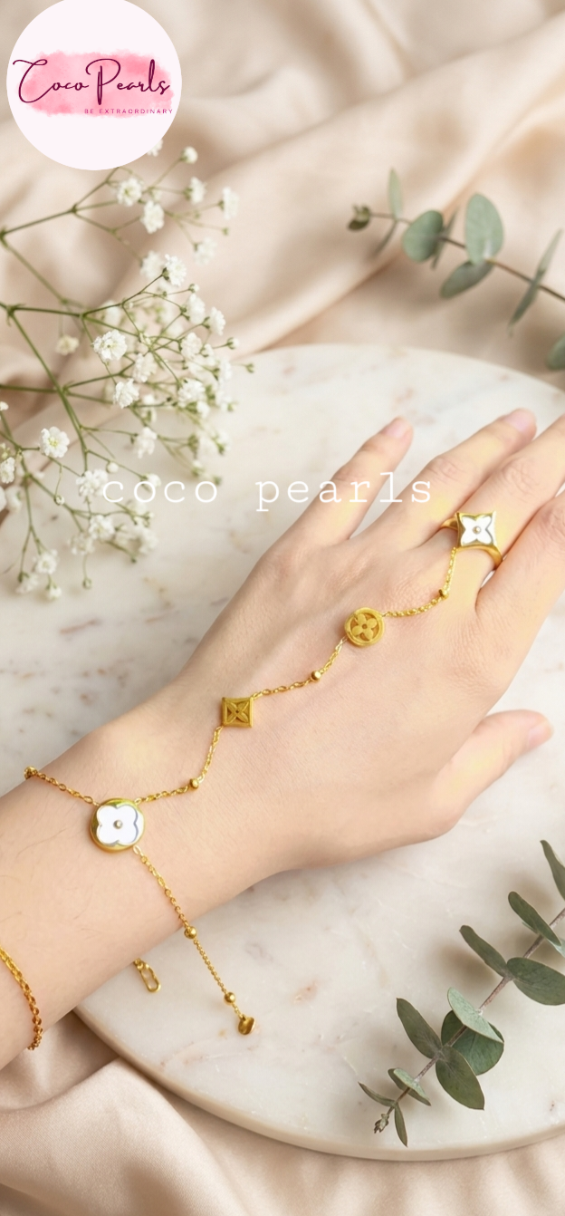 Coco pearls stainless Steel anti tarnish clober hand harness with clovers displayed on hand