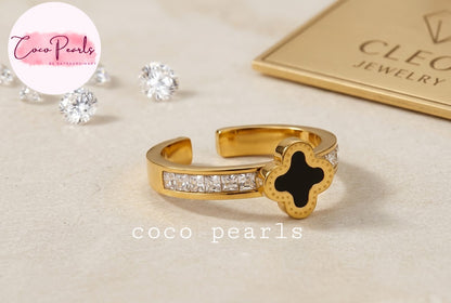 Coco pearls stainless Steel anti tarnish gold diamond studded adjustable ring with black clover in center