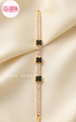 Coco pearls clover tennis bracelet displayed on simple background 