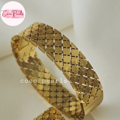 Coco pearls stainless Steel anti tarnish gold gold-plated woven mesh cuff bracelet with a textured, diamond-patterned surface, displayed on a clean white background