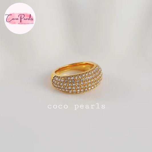 Coco pearls stainless Steel anti tarnish gold ring with two rows of clear pavé-set stones, photographed on a light neutral background. 