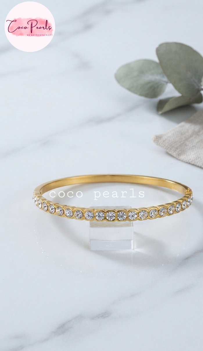 Coco pearls stainless Steel anti tarnish diamond studded handcuff displayed on simple background 