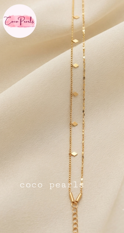 Coco pearls stainless Steel anti tarnish gold double layer anklet displayed on simple background 
