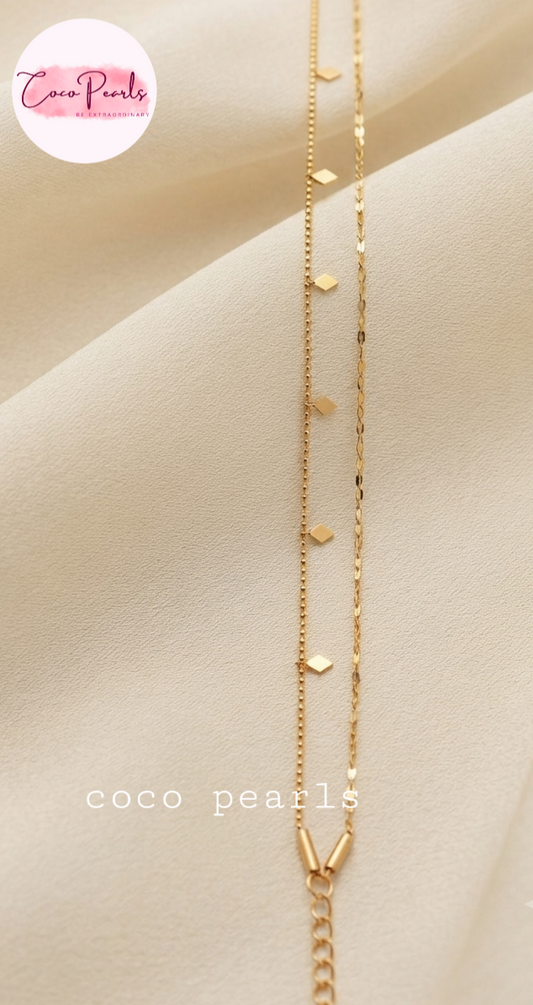 Coco pearls stainless Steel anti tarnish gold double layer anklet displayed on simple background 