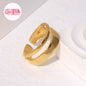Coco pearls stainless Steel anti tarnish gold dual wave ring displayed on simple background 