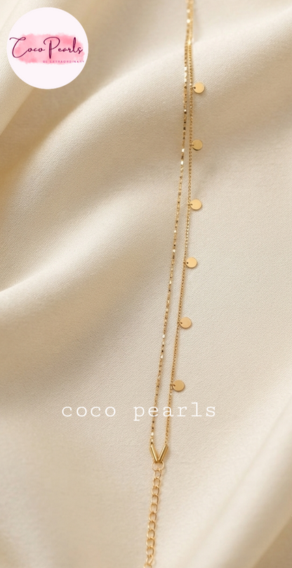 Coco pearls stainless Steel anti tarnish gold dual chain anklet displayed on simple background 
