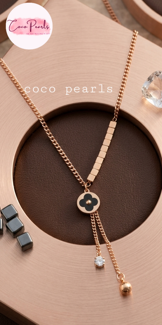 coco pearls stainless steel anti tarnish waterproof Fortune Clover Charm Necklace displayed on a simple background