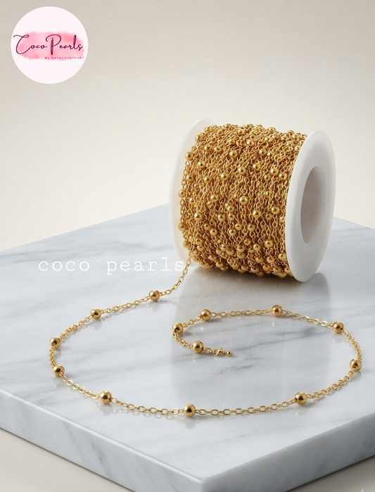 Coco pearls stainless Steel anti tarnish gold ball chain displayed on simple background 