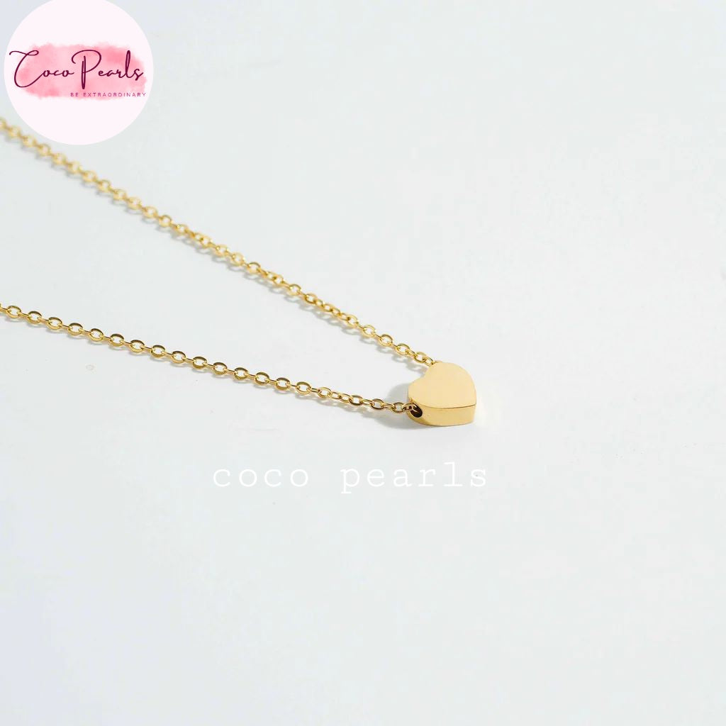 Coco pearls stainless Steel anti tarnish delicate gold chain necklace with a small, polished gold heart pendant, displayed on a clean white background.