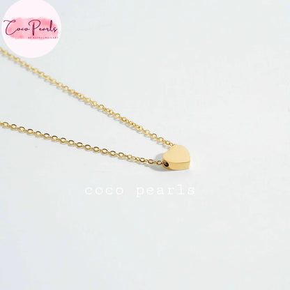 Coco pearls stainless Steel anti tarnish delicate gold chain necklace with a small, polished gold heart pendant, displayed on a clean white background.