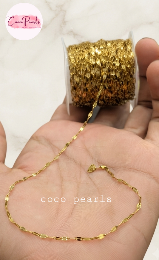 Coco pearls stainless Steel anti tarnish golden rice chain displayed on simple background 