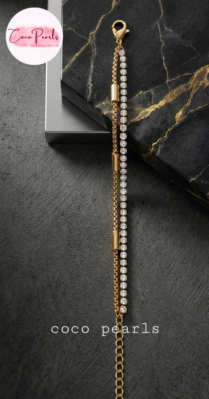 Coco Pearls Stainless steel Anti Tarnish Golden stream link bracelet with double layer chain. a diamond studded line and golden chain displayed a white background