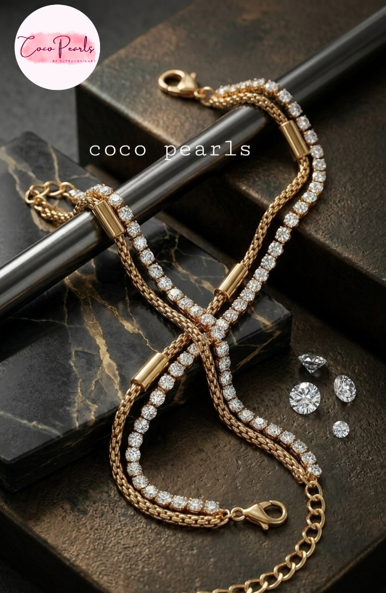 Coco Pearls Stainless steel Anti Tarnish Golden stream link bracelet with double layer chain. a diamond studded line and golden chain displayed a white background