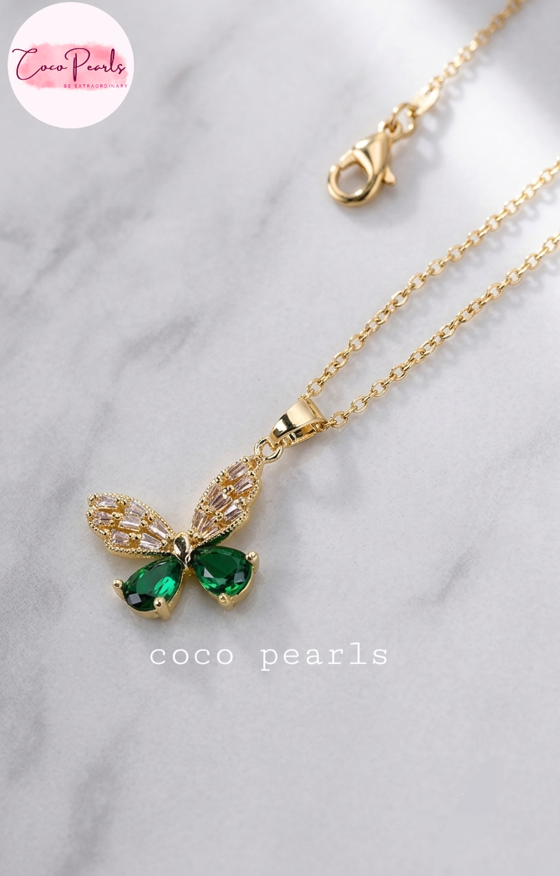 Coco pearls stainless Steel anti tarnish Gold butterfly pendant necklace with green teardrop gemstones and clear rhinestone wings.
