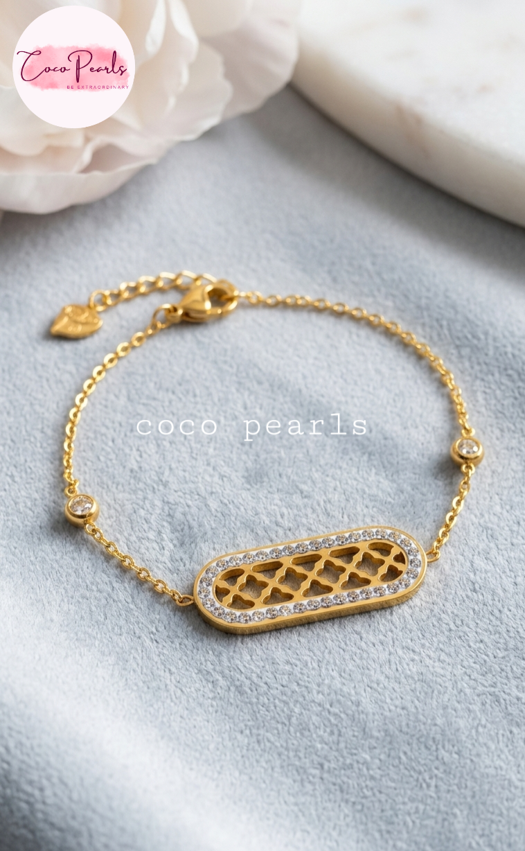 Coco pearls stainless Steel anti tarnish Gold halo bracelet with intricate design on a light gray surface