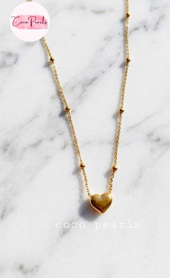 Coco Pearls Stainless Steel Anti Tarnish Gold heart desire necklace with heart pendants and ball chain on a light background