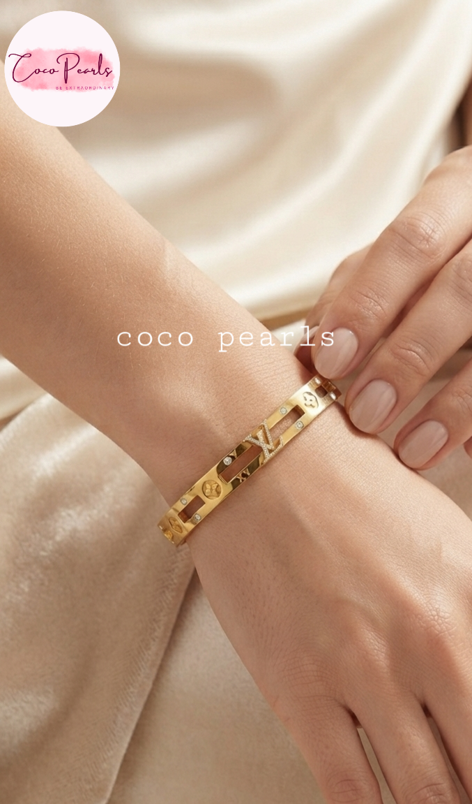 Coco pearls stainless Steel anti tarnish gold handcuff with gold design displayed on hand