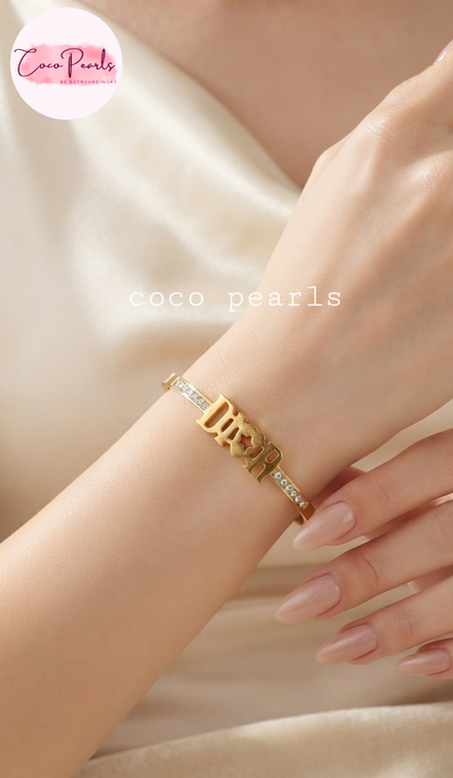 Coco pearls stainless Steel anti tarnish gold diamond studded handcuff displayed on hand