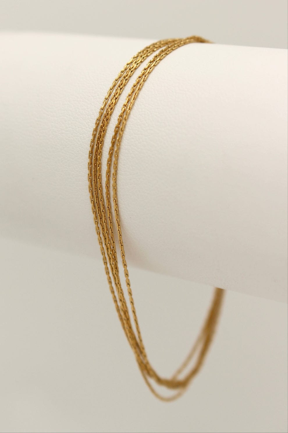 Coco pearls stainless Steel anti tarnish gold  thread bracelet displayed on simple background