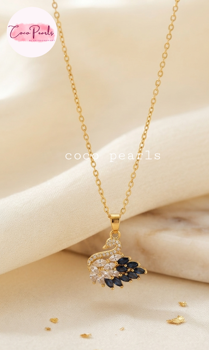 Coco pearls stainless Steel anti tarnish gold  midnight diamond studded swan necklace displayed on simple background 