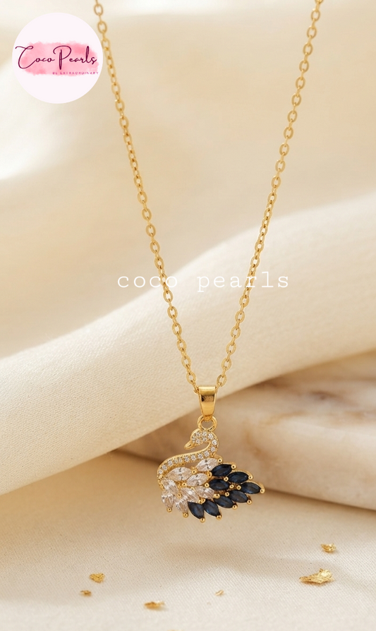 Coco pearls stainless Steel anti tarnish gold  midnight diamond studded swan necklace displayed on simple background 