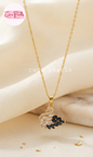 Coco pearls stainless Steel anti tarnish gold  midnight diamond studded swan necklace displayed on simple background 