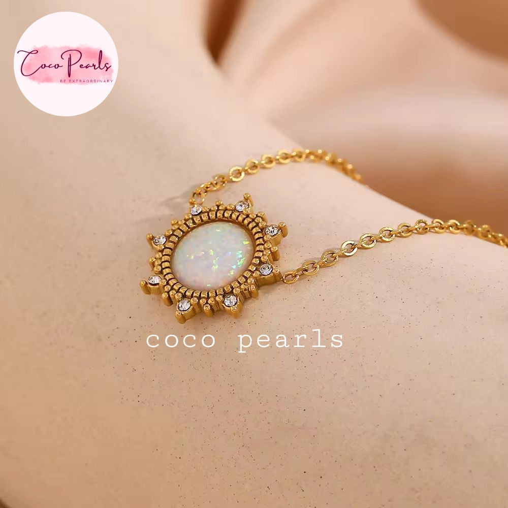 Coco pearls stainless Steel anti tarnish gold opal Neclace displayed on simple background 